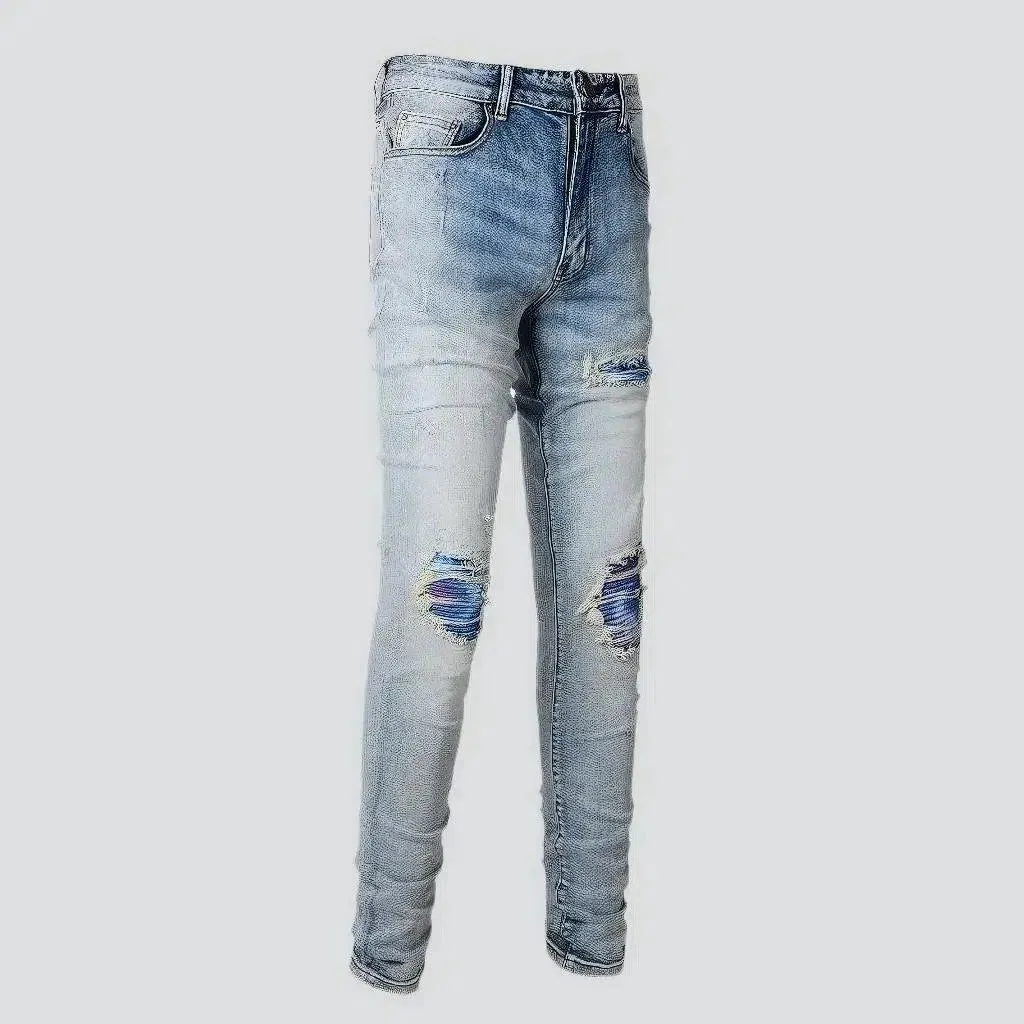 Light-wash distressed jeans