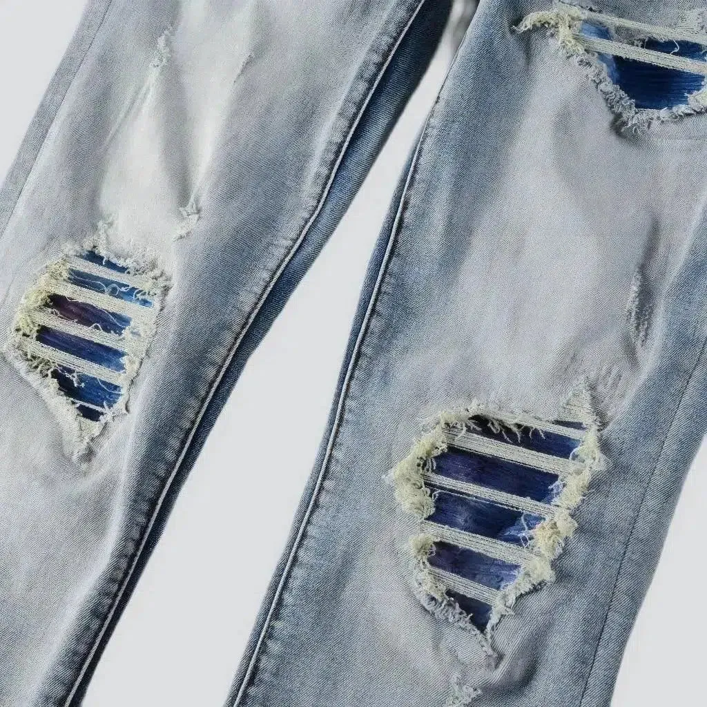 Light-wash distressed jeans